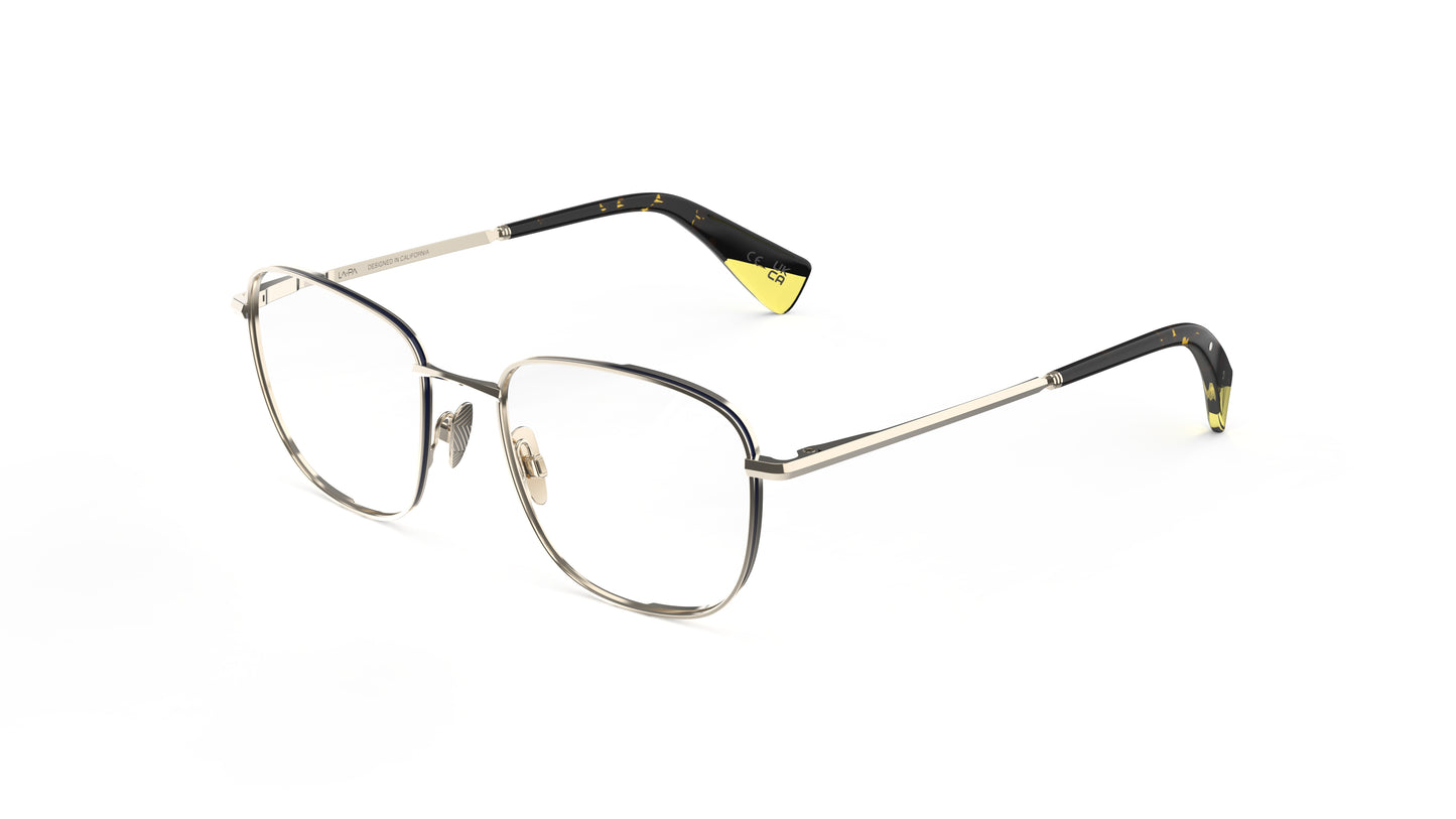 A pair of gold titanium eyeglasses, featuring a light gold frame and dark tortoiseshell temple tips with yellow accents. Integrated spring hinges and nosepads.