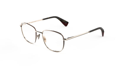 A pair of classic-style titanium eyeglasses with an almond-toned construction, nosepads and integrated spring hinge, shown on a plain white background.