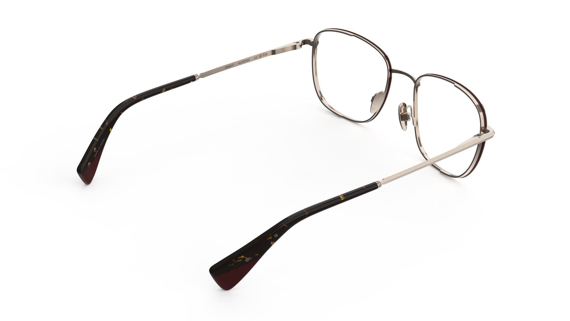 Rear view of a soft square eyeglasses with almond titanium rims, nosepads and tortoiseshell temple arms, shown on a plain white background.