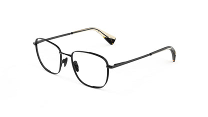 Gunmetal titanium eyeglasses with nosepads and integrated spring hinges, and khaki tortoiseshell temple tips, shown on a plain white background.