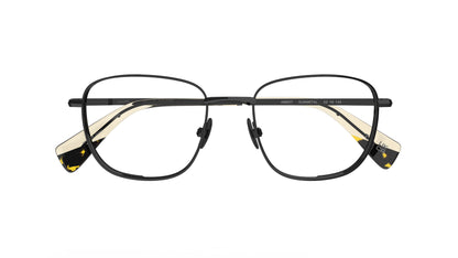 A pair of square gunmetal navigator titanium eyeglass frames with nosepads and cream acetate accents at the temple tips, shown against a plain white background.