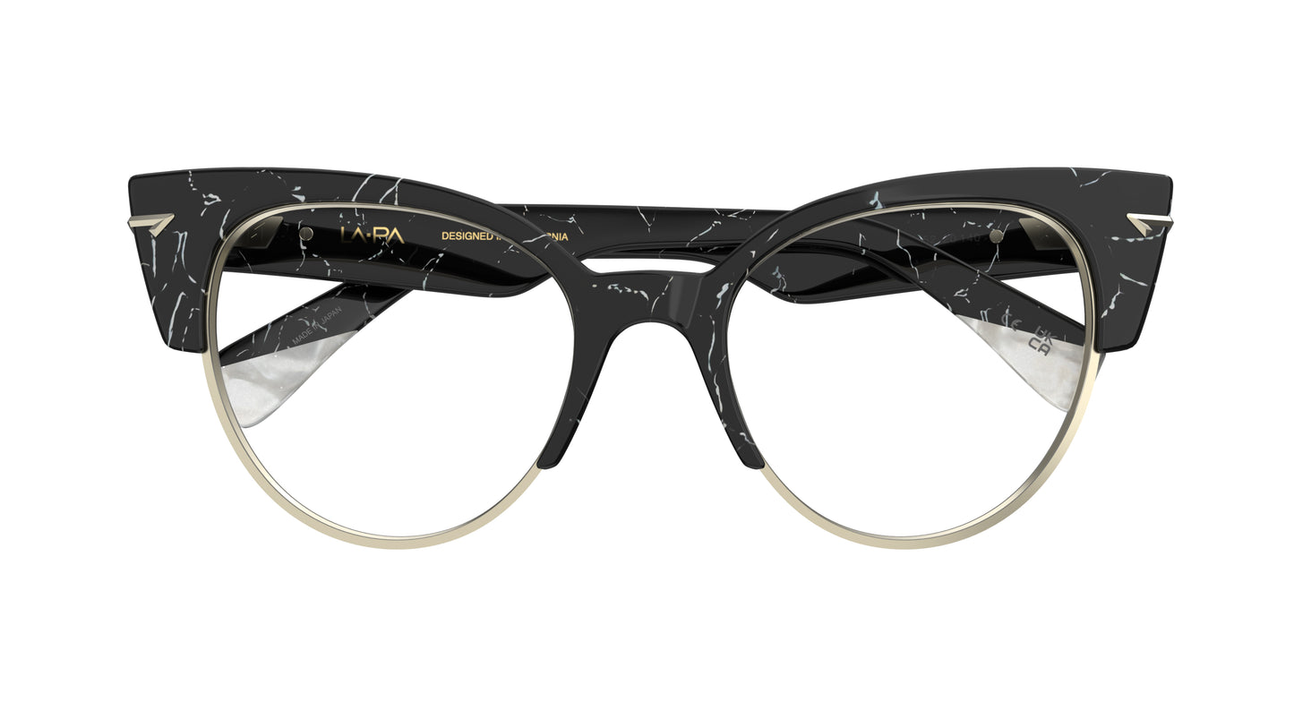 A pair of modern cat-eye eyeglasses featuring a black and white marble-patterned acetate frame with a thin silver metal rim and silver sculpted metal rivets.