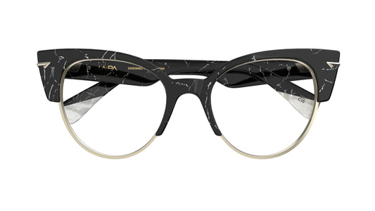 A pair of modern cat-eye eyeglasses featuring a black and white marble-patterned acetate frame with a thin silver metal rim and silver sculpted metal rivets.