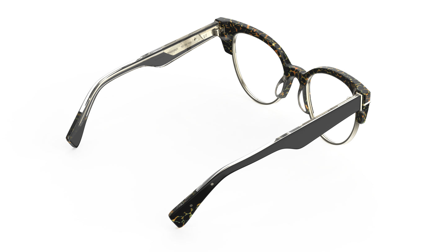 A rear view of a pair of cateye eyeglasses with an animal print acetate frame and black temple tips, shown on a plain white background.