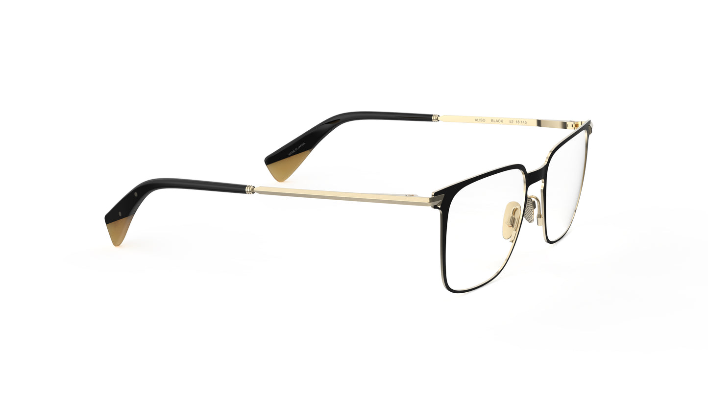 A pair of quality titanium eyeglasses with a black titanium front and light gold sculpted titanium temples and nosepads, integrated spring hinge, shown on a clean white background.
