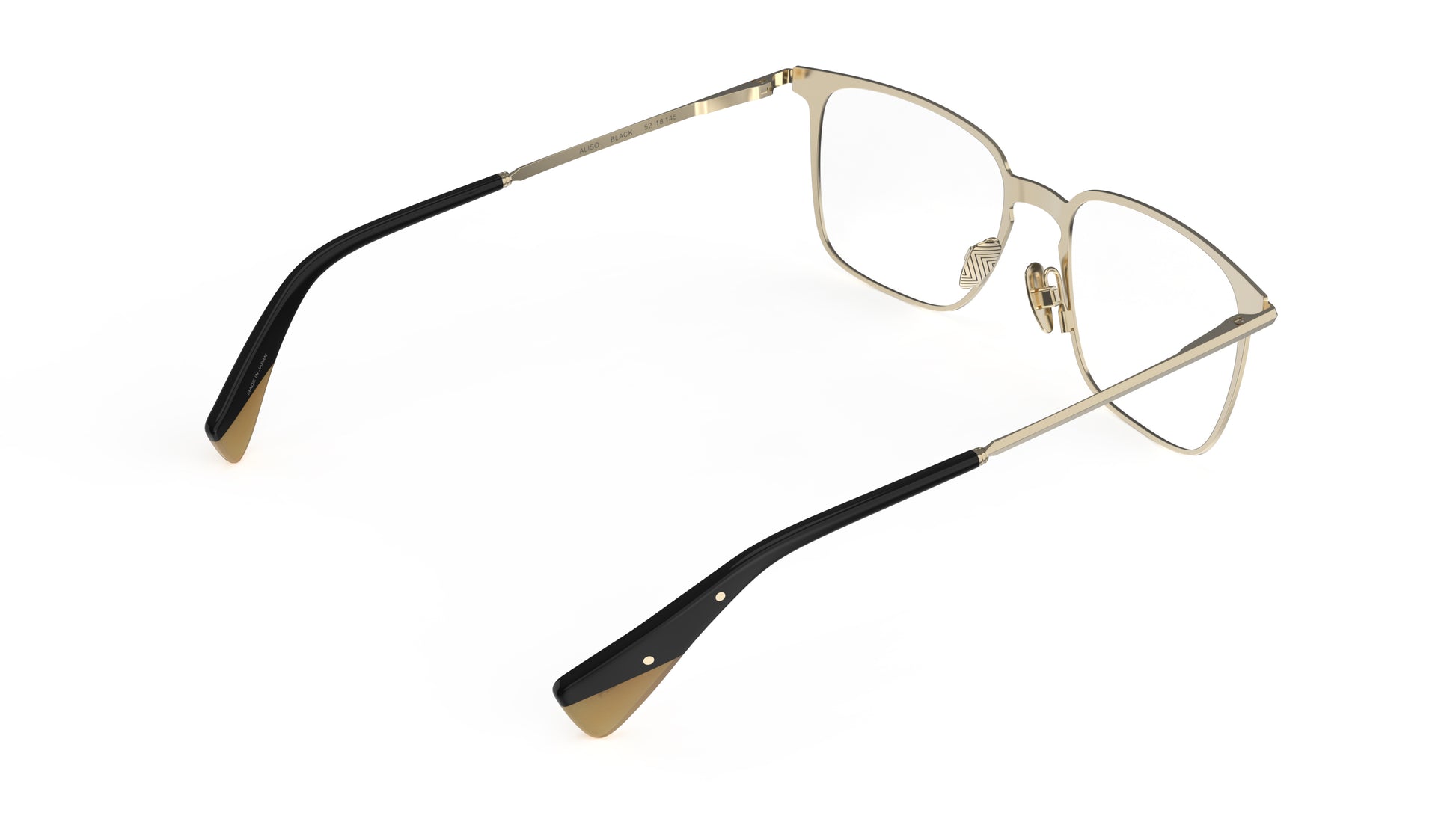 A pair of quality titanium eyeglasses with a light gold inner frame with sculpted titanium temples and nosepads with an integrated spring hinge,shown on a clean white background.