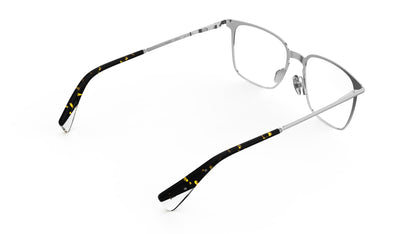 A rear view of a titanium eyeglasses with silver temples and titanium nosepads and integrated spring hinge, shown on a white background.