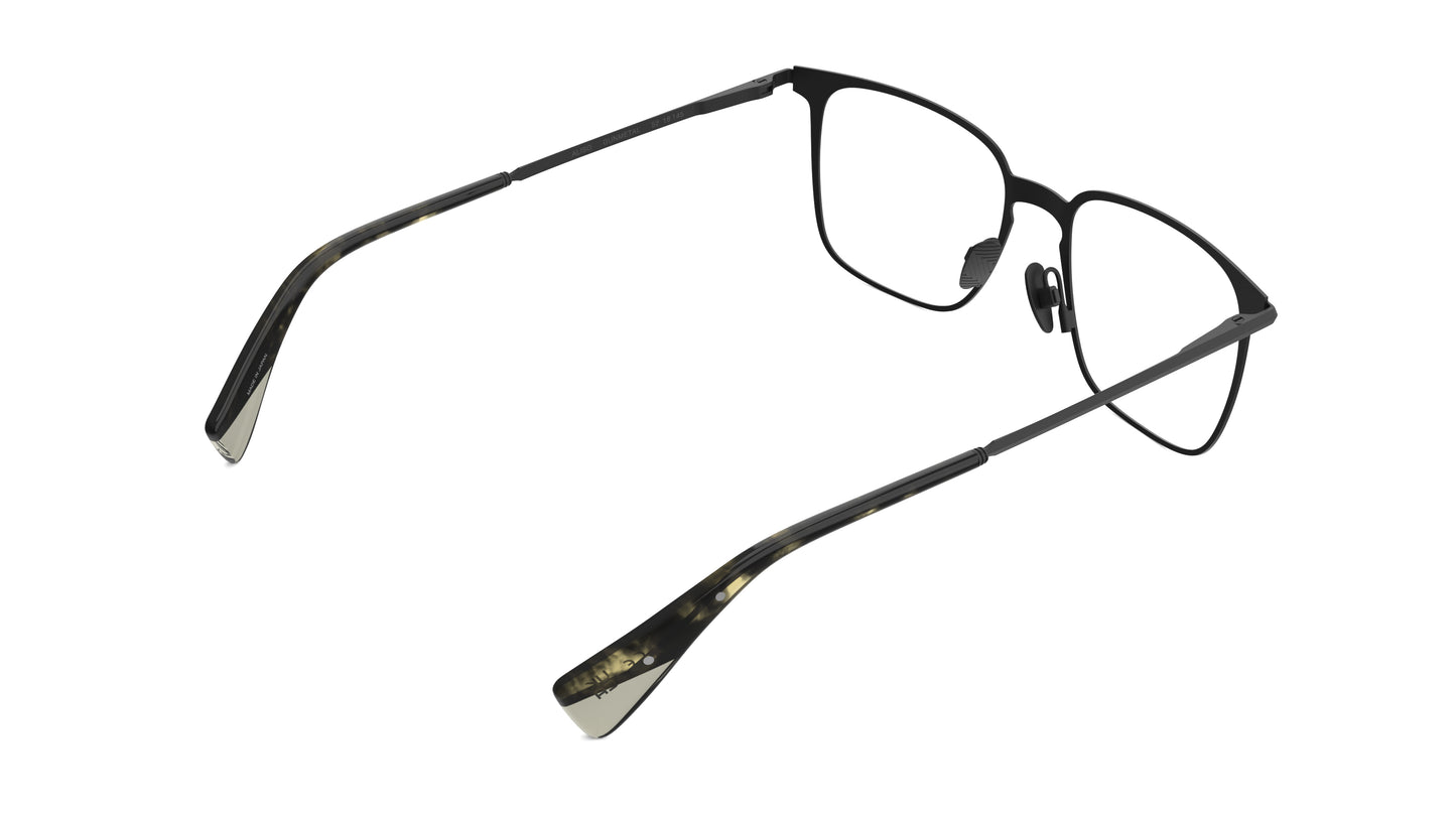 A rear view of a gunmetal titanium frame with an integrated spring hinge and nosepads, shown on a plain white background.