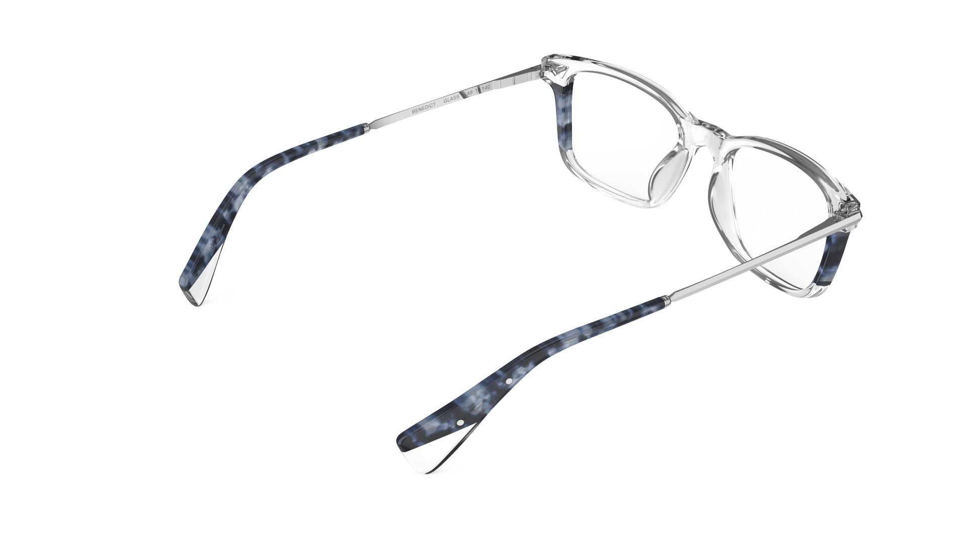 Rear view of eyeglasses with a clear acetate frame and dark blue havana temple tips, silver titanium temples with integrated spring hinges, shown on a plain white background.