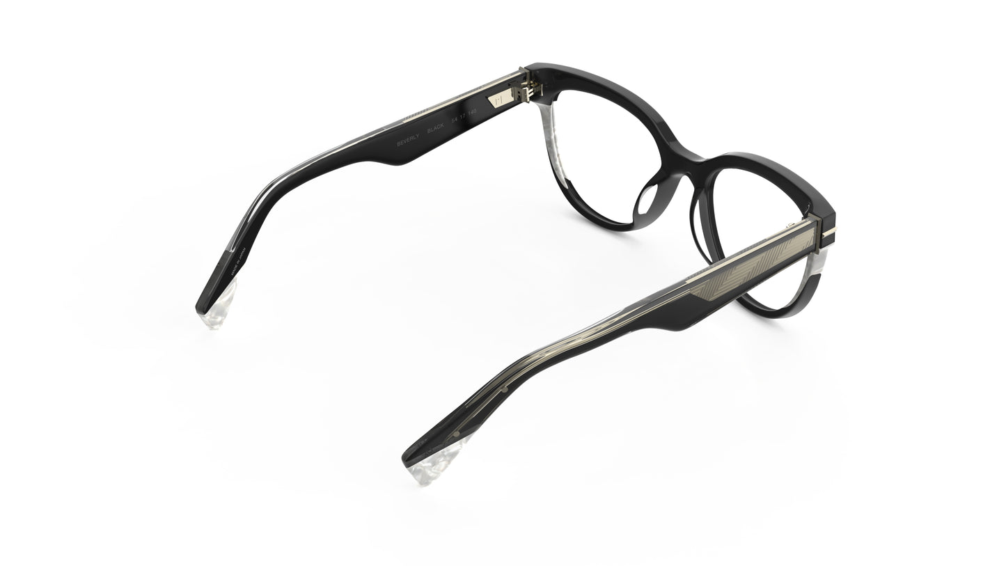 A rear view of a pair of cateye eyeglasses featuring a black acetate front with pearl accents, clear lenses, and geometric patterned wire cores, shown on a plain white background.