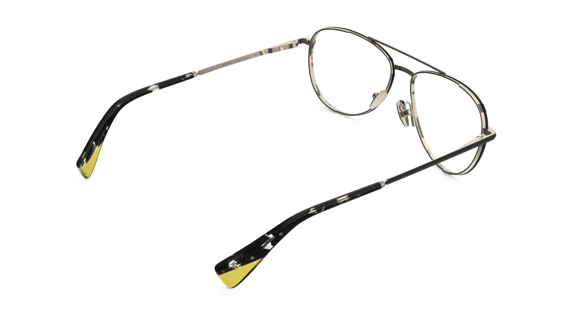Rear view of aviator-style eyeglasses with light gold titanium construction, and dark tortoiseshell temple tips with yellow accents, integrated spring hinge shown on a plain white background.