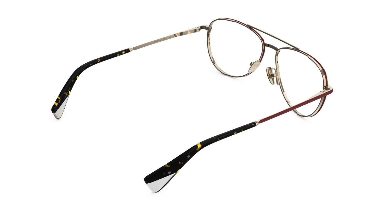 Rear view of an aviator eyeglasses with a red and gold titanium frame, nosepads and integrated spring hinge, on a white background.