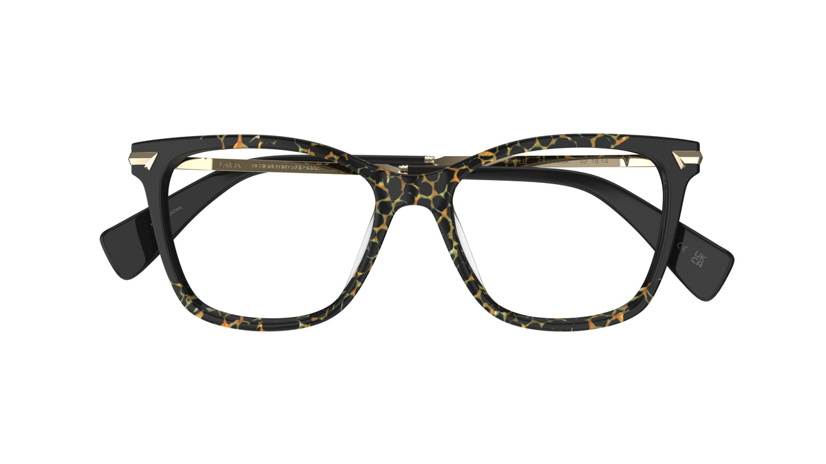 A pair of butterfly-frame eyeglasses with a black and animal print pattern acetate front, gold metal accents on the hinge area, shown against a plain white background.