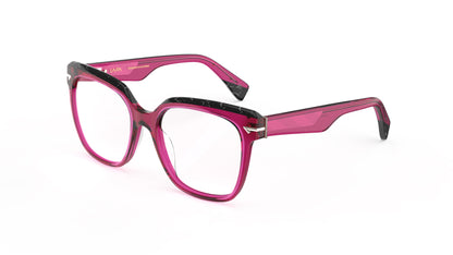 A pair of oversized square eyeglasses featuring a translucent fuchsia acetate with black marbled acetate top rim and temple tips with geometric patterned metal wire cores, shown against a plain white background.