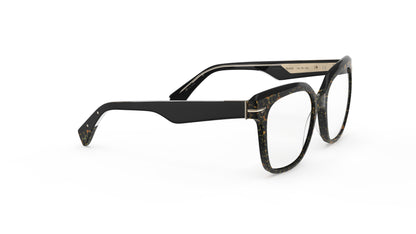 A pair of oversized square acetate eyeglasses featuring a black, brown, and gold tortoiseshell pattern on the front and solid black temples, shown on a plain white background.