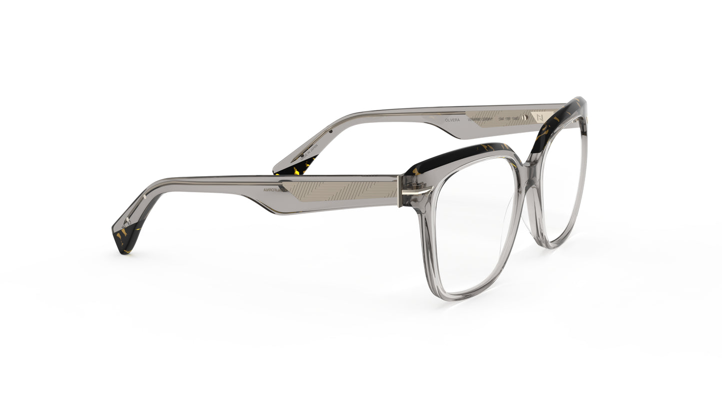A pair of oversized square eyeglasses with a translucent warm gray acetate frame with a geometric patterned metal wire core, shown on a plain white background.