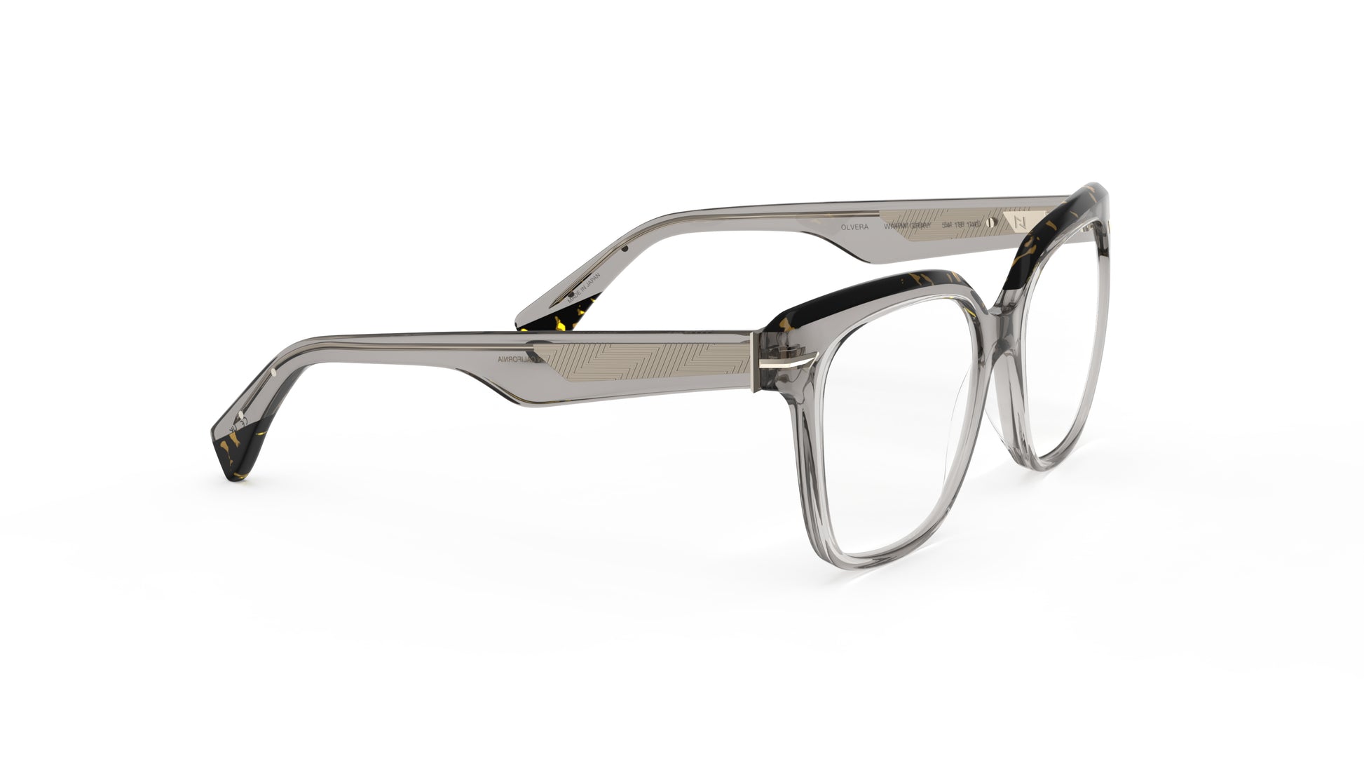 A pair of oversized square eyeglasses with a translucent warm gray acetate frame with a geometric patterned metal wire core, shown on a plain white background.