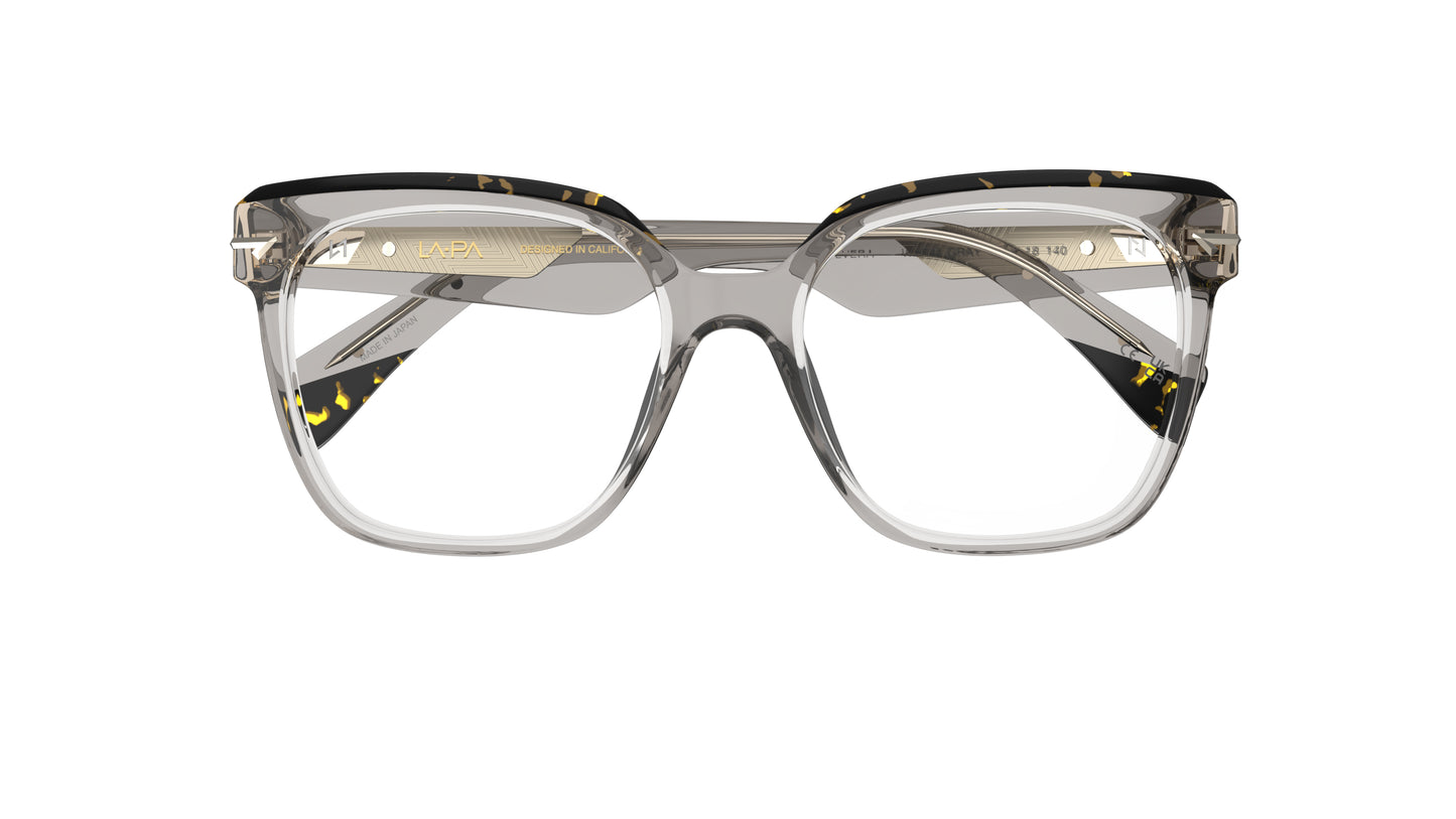 A pair of oversized square eyeglasses with a translucent warm gray acetate frame, featuring a tortoiseshell pattern on the brow and temple tips, shown against a plain white background.