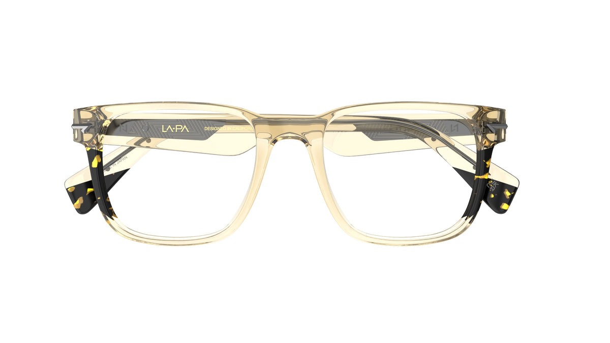 A pair of square eyeglasses featuring a translucent khaki acetate frame with dark tortoiseshell-patterned accents with sculpted rivets.