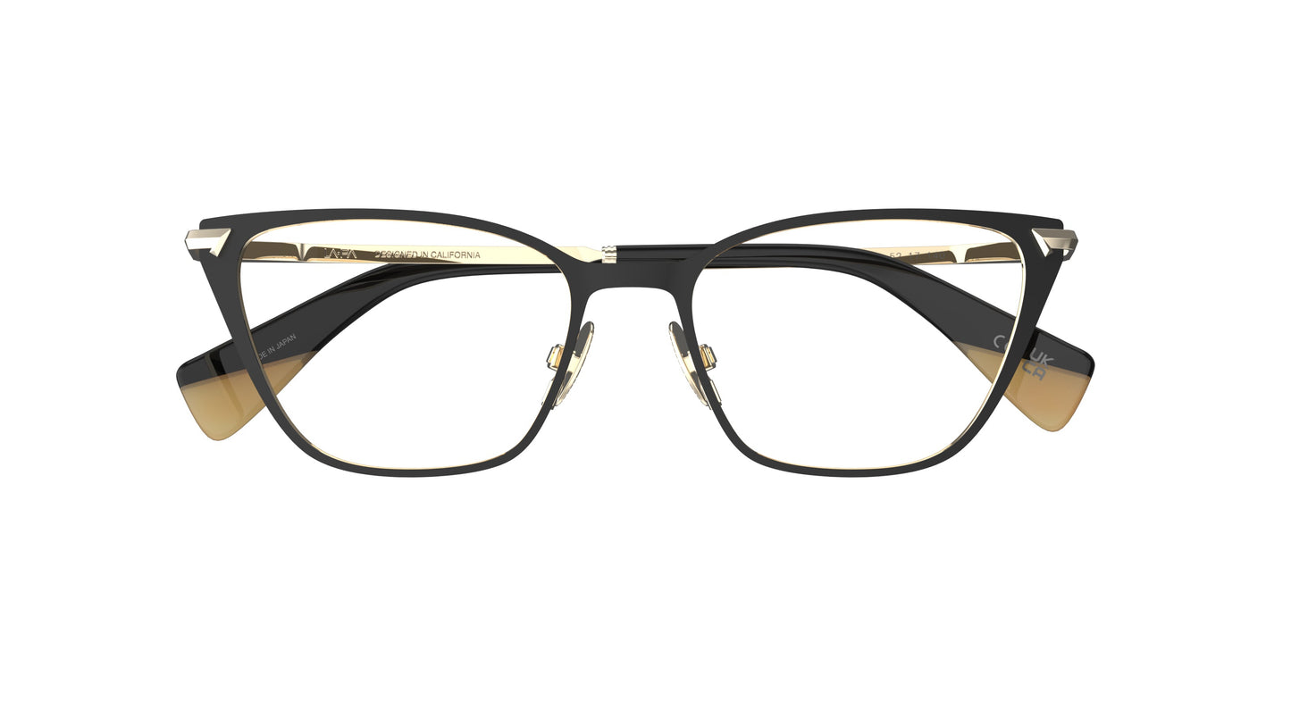 A pair of cateye eyeglasses featuring a black titanium frame with gold nosepads and acetate temple tips, set against a plain white background.