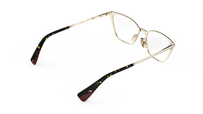 A rear view of a pair of cateye titanium eyeglasses with a gold-tone inner frame and tortoiseshell acetate temple tips, shown on a plain white background.
