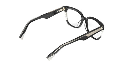 A rear view of a pair of square eyeglasses with a black acetate front with white pearl accents, geometric patterned metal wire cores, shown on a plain white background.