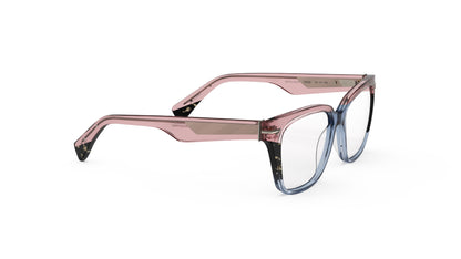 A pair of cat-eye oversized square eyeglasses featuring a translucent pink acetate frame that transitions into a blue gradient at the bottom, with tortoiseshell accents. Geometric patterned wire cores, shown on a plain white background.