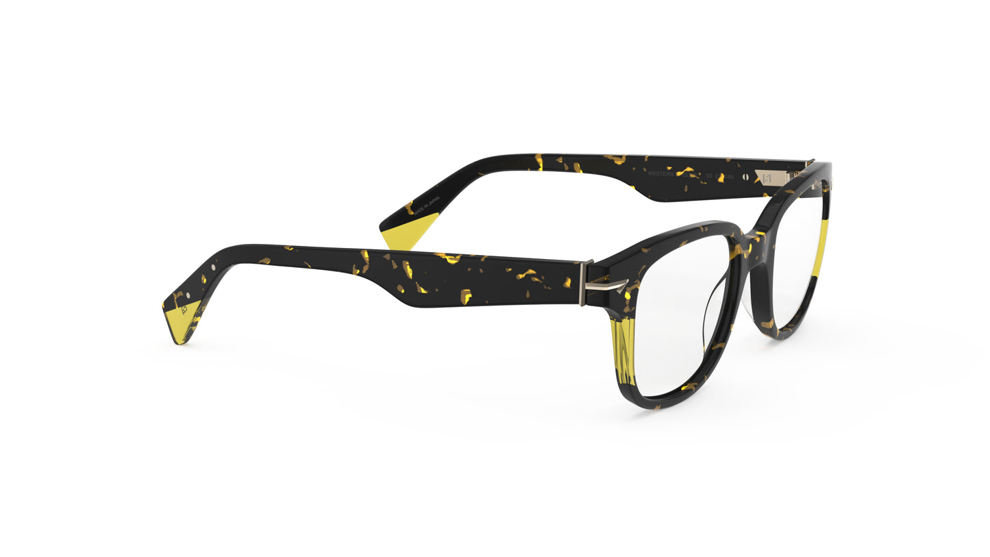 A pair of square eyeglasses with a dark tortoiseshell front with translucent yellow accents, shown on a plain white background.
