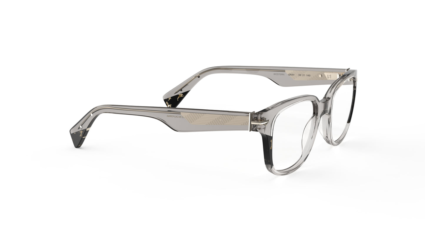 A pair of warm gray acetate eyeglass frames with smoky tortoise accents, geometric patterned metal wire core, shown from a three-quarters angle on a white background.