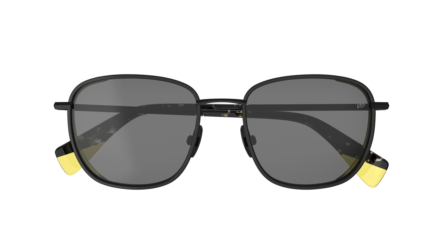 Navigator square sunglasses with a black frame, polarized gray lenses, and yellow temple tips, shown against a plain white background.